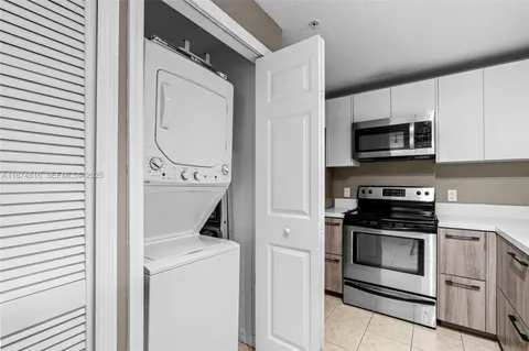 a kitchen with a stove and a microwave