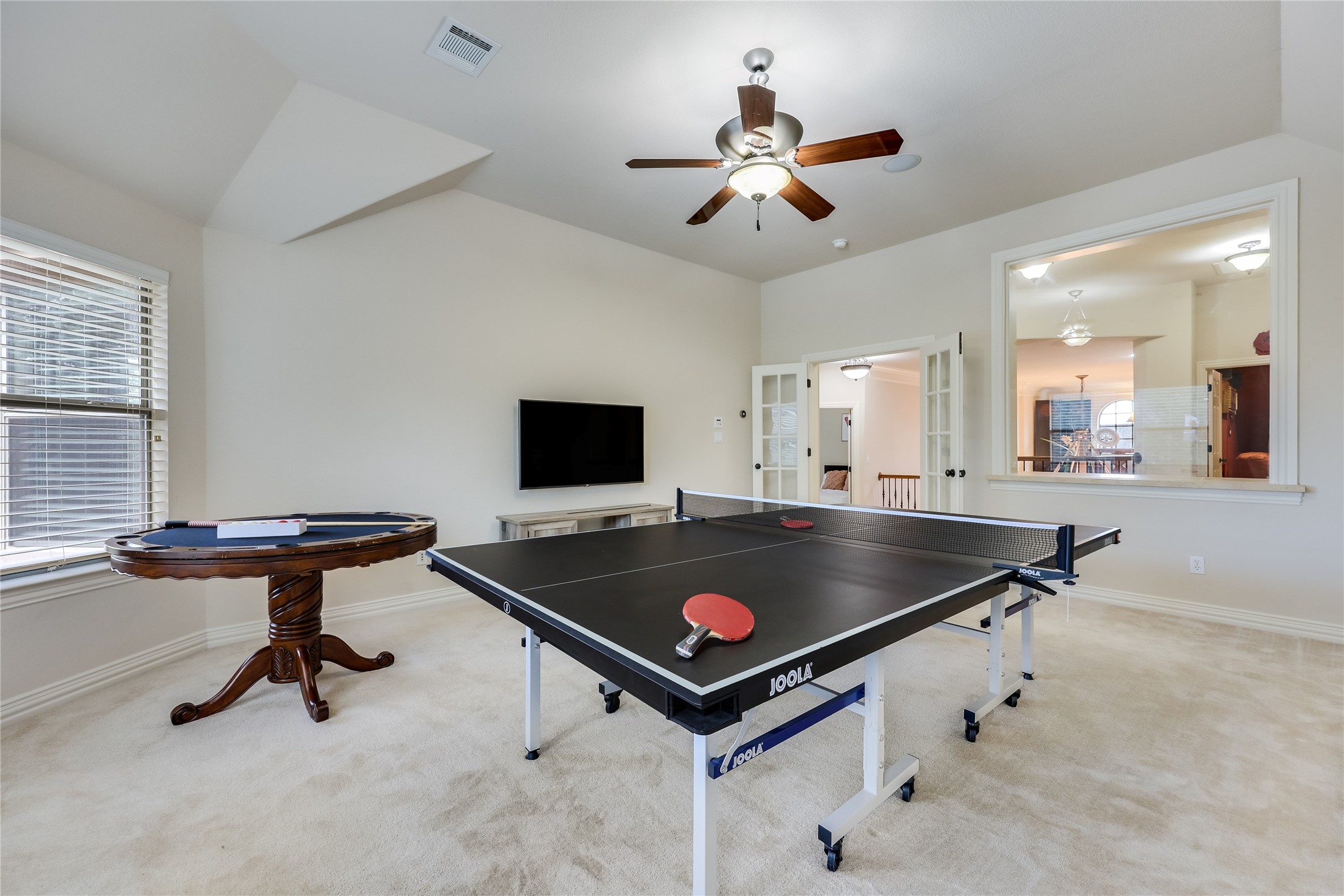 408 Ridgetop Bend Cedar Park, TX 78613 - Photo 33 of 40 A vibrant game room offers a lively atmosphere for recreation and social gatherings.