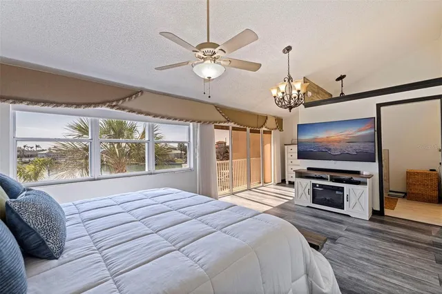 a room with table chairs and chandelier
