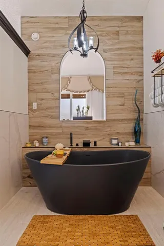 a bathroom with a shower and a glass door
