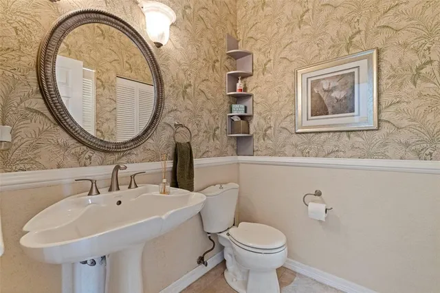 a bathroom with a toilet and a sink