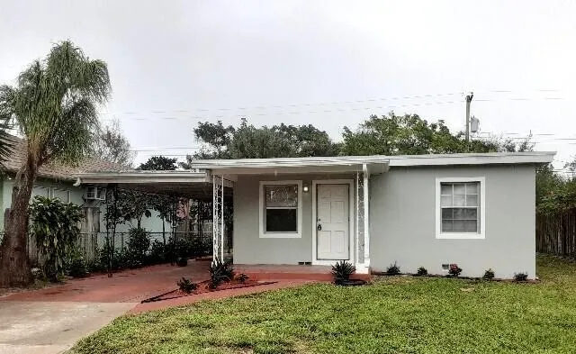 a view of front a house with a yard
