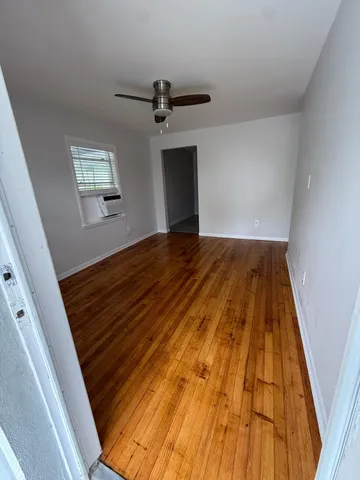 a kitchen with granite countertop a sink dishwasher a stove and a microwave oven