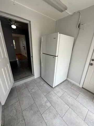 a bathroom with a toilet sink and shower