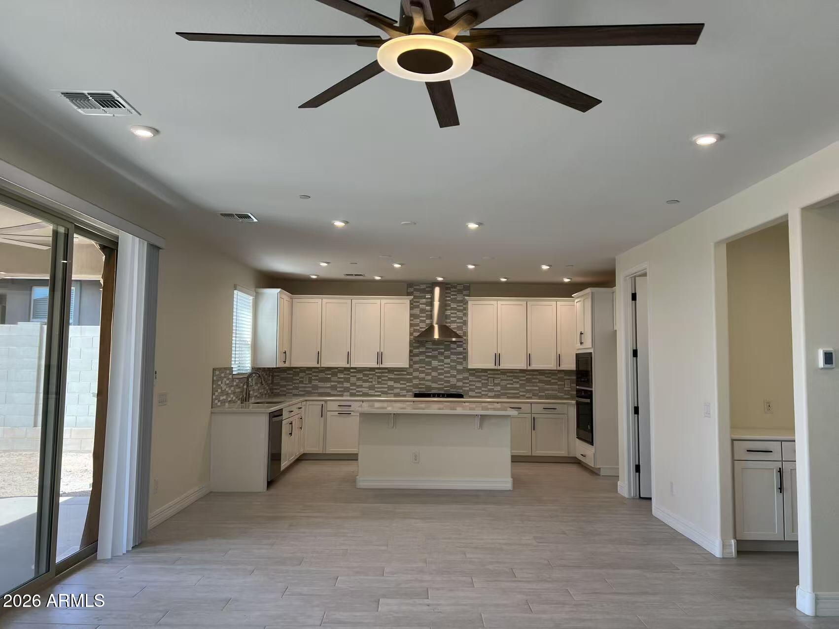 13359 West Eagle Feather Road Peoria, AZ 85383 - Photo 19 of 43 a kitchen with a refrigerator and window
