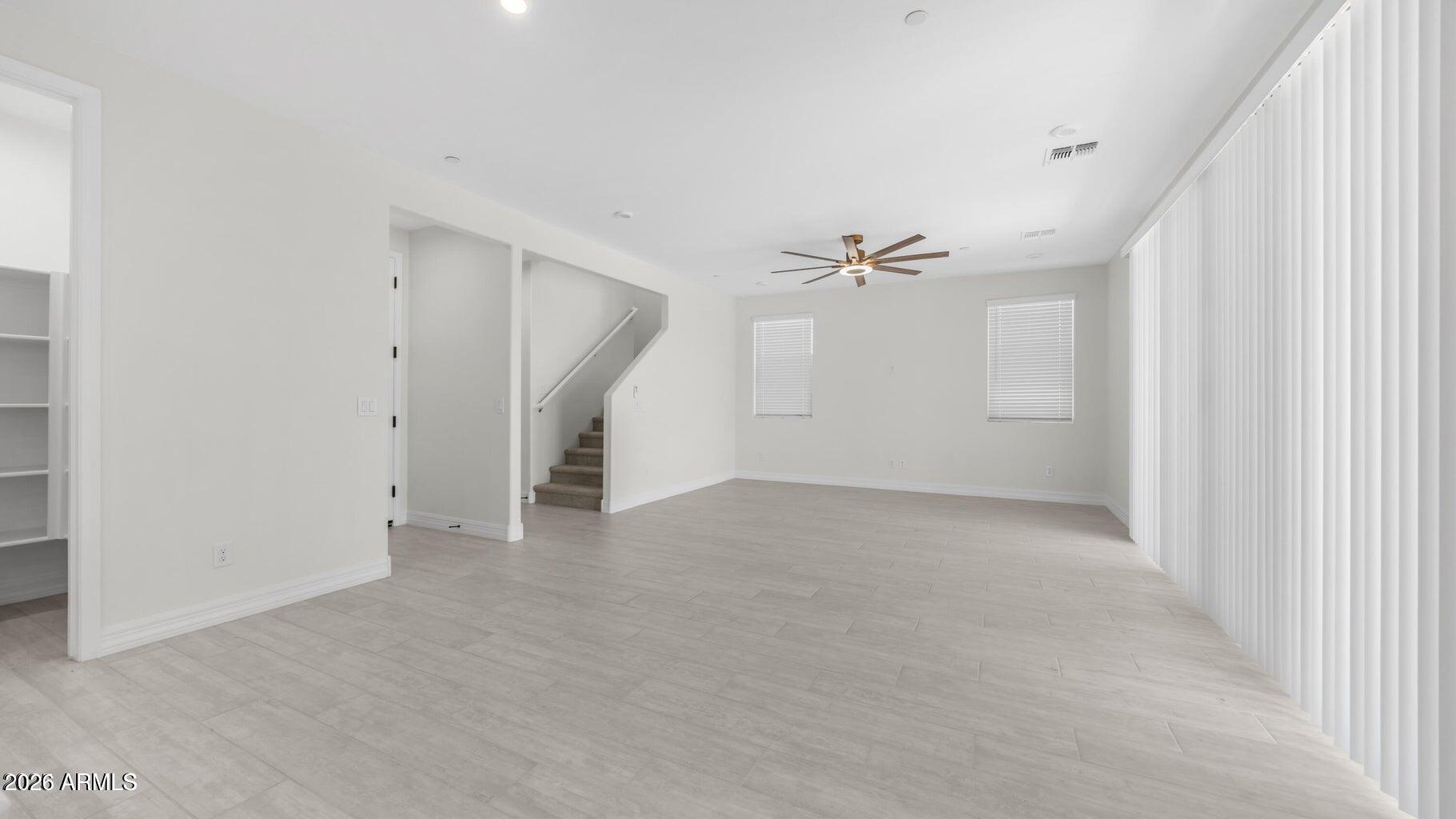 13359 West Eagle Feather Road Peoria, AZ 85383 - Photo 21 of 43 a view of a big room with a ceiling fan