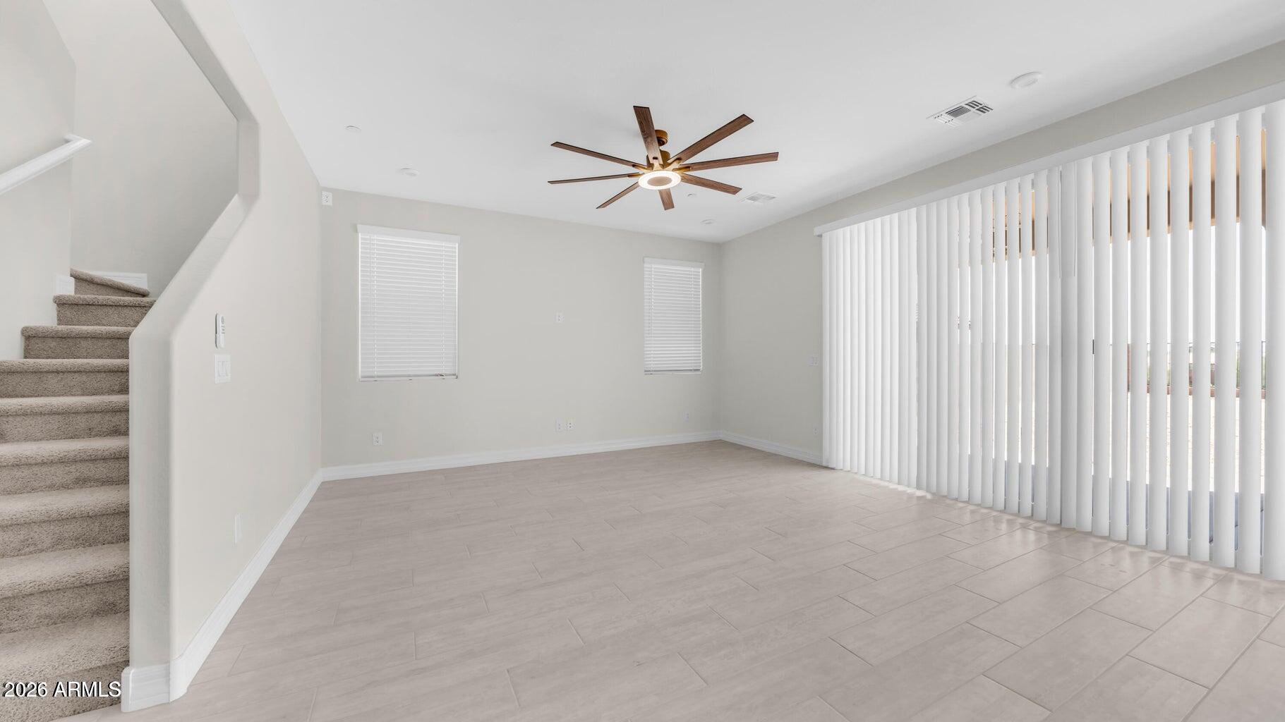 13359 West Eagle Feather Road Peoria, AZ 85383 - Photo 22 of 43 an empty room with windows and fan