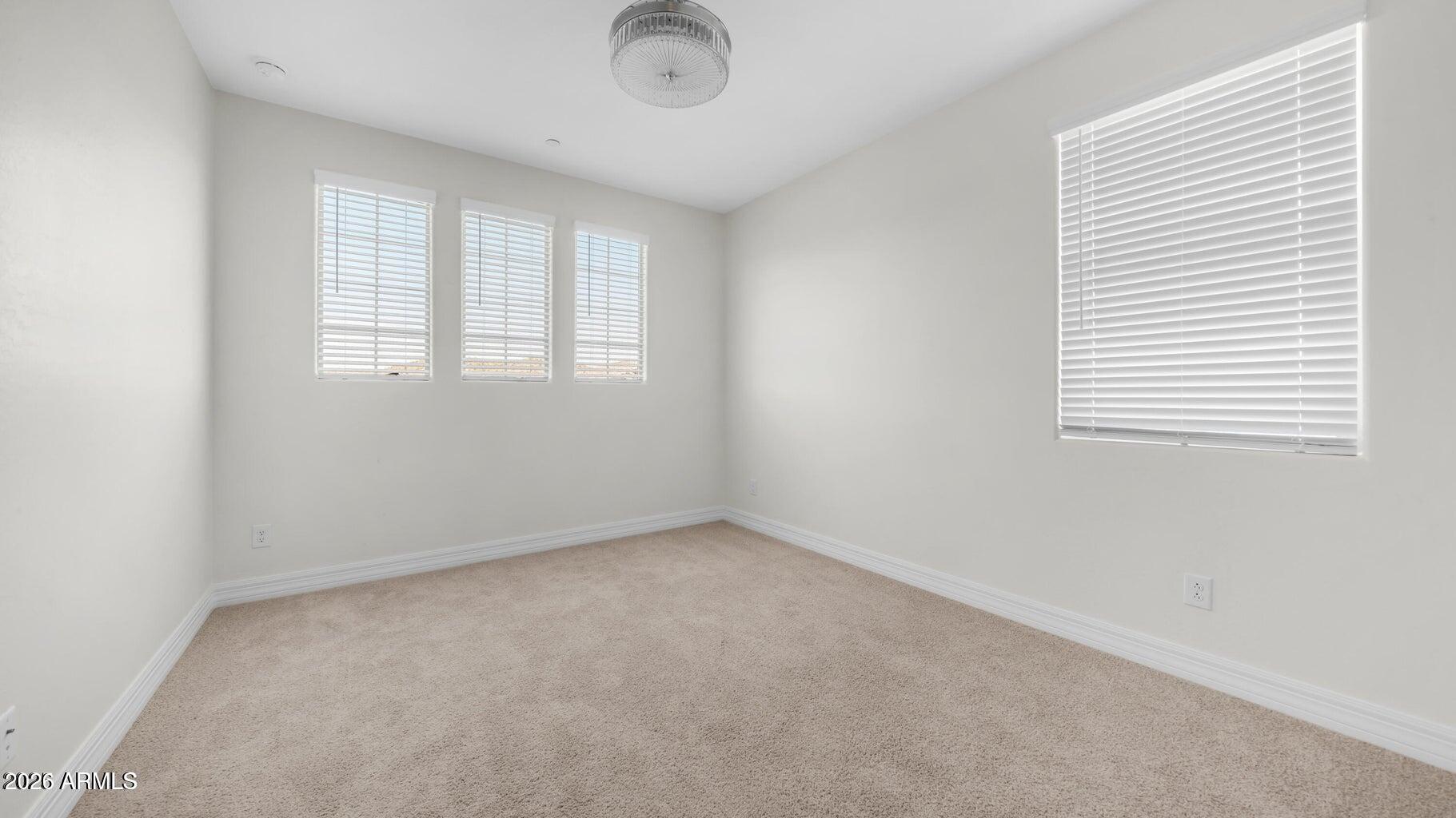 13359 West Eagle Feather Road Peoria, AZ 85383 - Photo 27 of 43 an empty room with a window