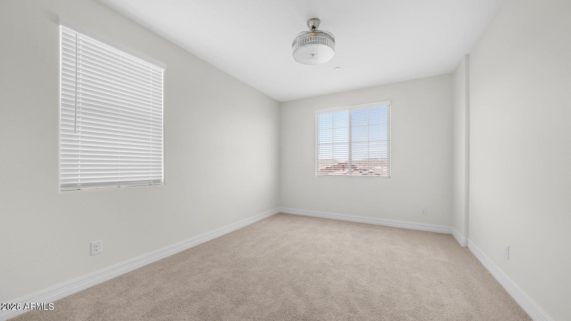 13359 West Eagle Feather Road Peoria, AZ 85383 - Photo 29 of 43 an empty room with windows