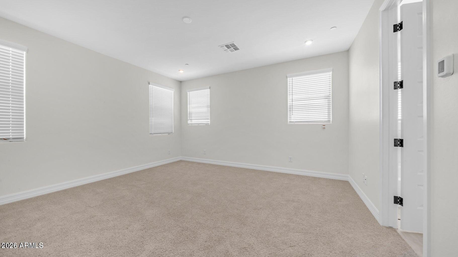 13359 West Eagle Feather Road Peoria, AZ 85383 - Photo 30 of 43 an empty room with windows