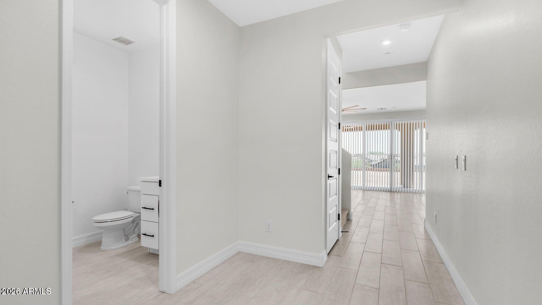 13359 West Eagle Feather Road Peoria, AZ 85383 - Photo 3 of 43 a bathroom with a toilet and a shower