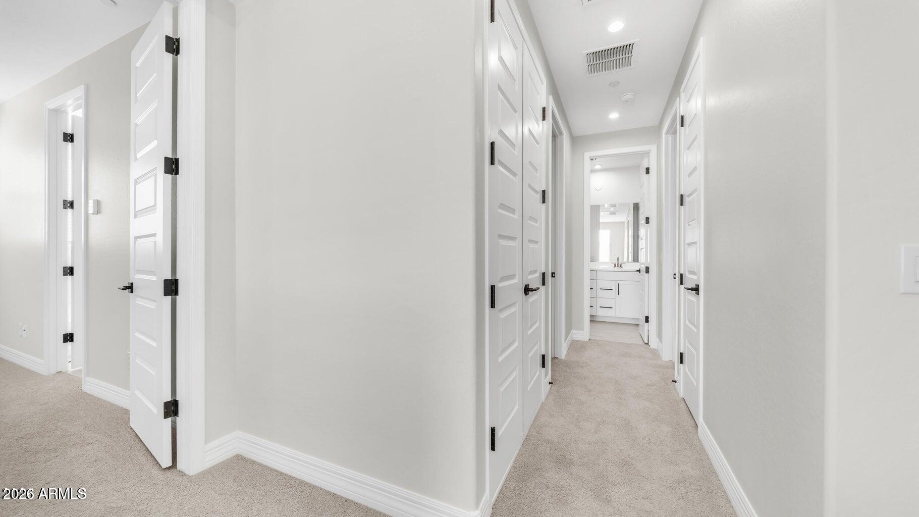 13359 West Eagle Feather Road Peoria, AZ 85383 - Photo 35 of 43 a view of a hallway with a dining area