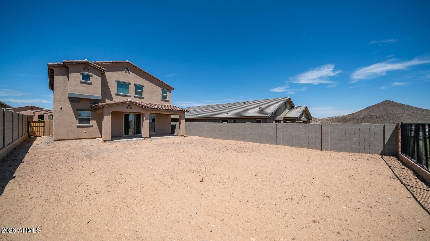 13359 West Eagle Feather Road Peoria, AZ 85383 - Photo 40 of 43 a front view of a house with yard