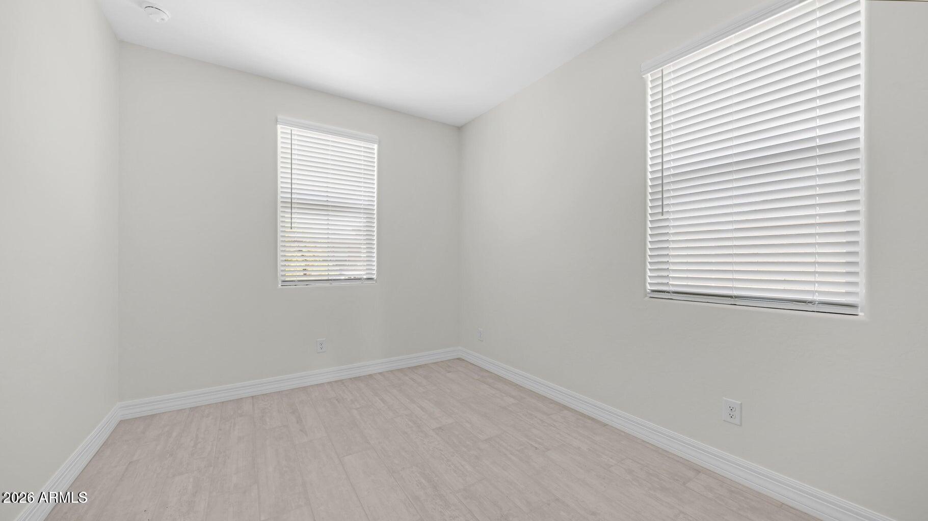 13359 West Eagle Feather Road Peoria, AZ 85383 - Photo 4 of 43 an empty room with a window