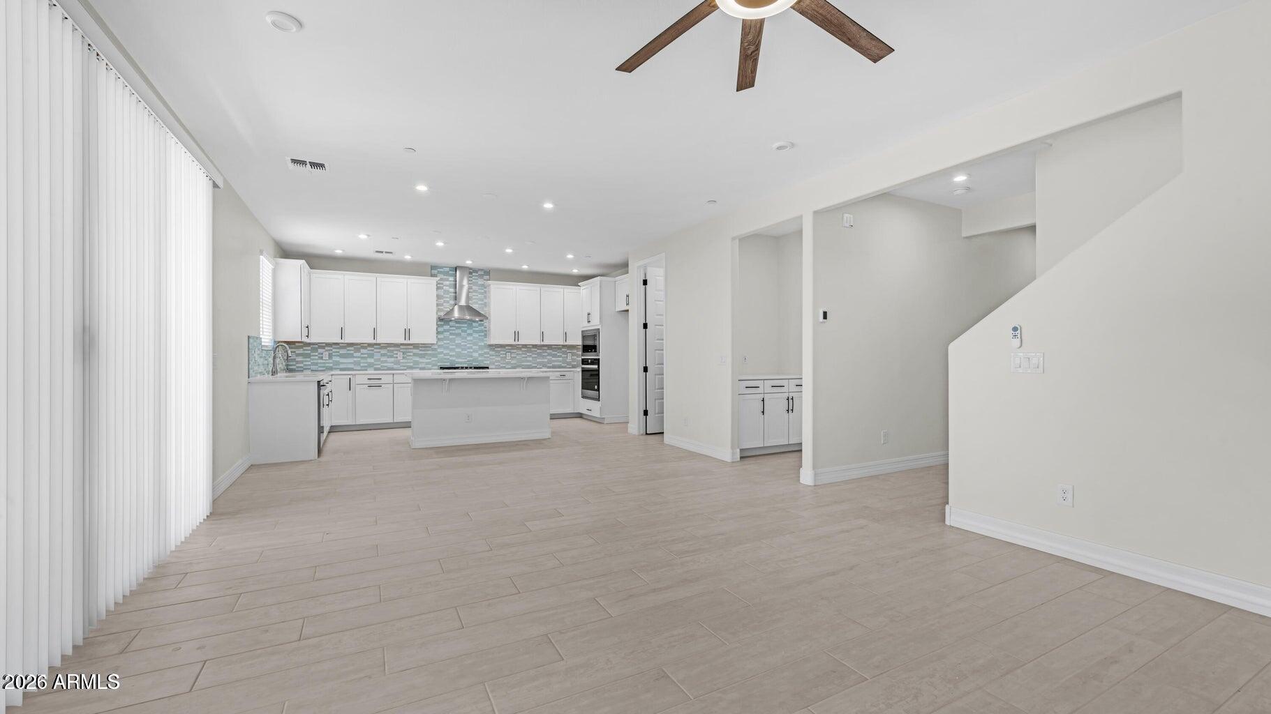 13359 West Eagle Feather Road Peoria, AZ 85383 - Photo 8 of 43 a view of kitchen with refrigerator sink and cabinets
