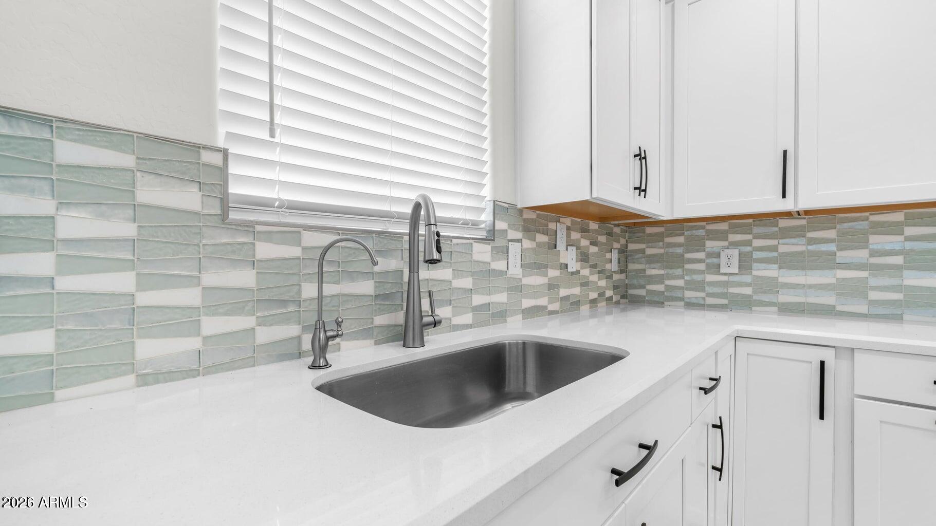 13359 West Eagle Feather Road Peoria, AZ 85383 - Photo 10 of 43 a kitchen with a sink and cabinets