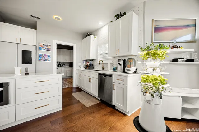 a bathroom with a stove and a shower