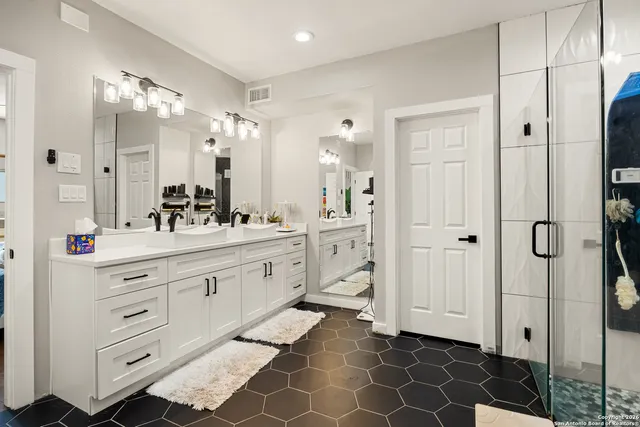 a bathroom with a sink and a shower
