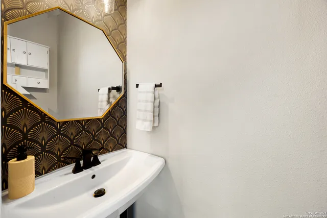 a bedroom with furniture and a wooden floor