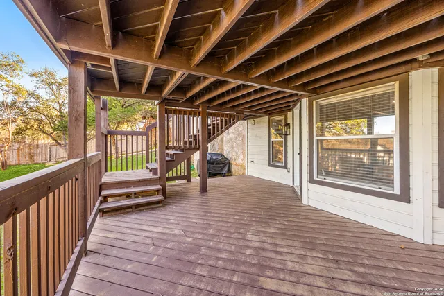 a view of a house with a backyard porch and sitting area