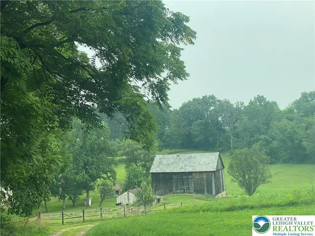 a back view of a house with backyard