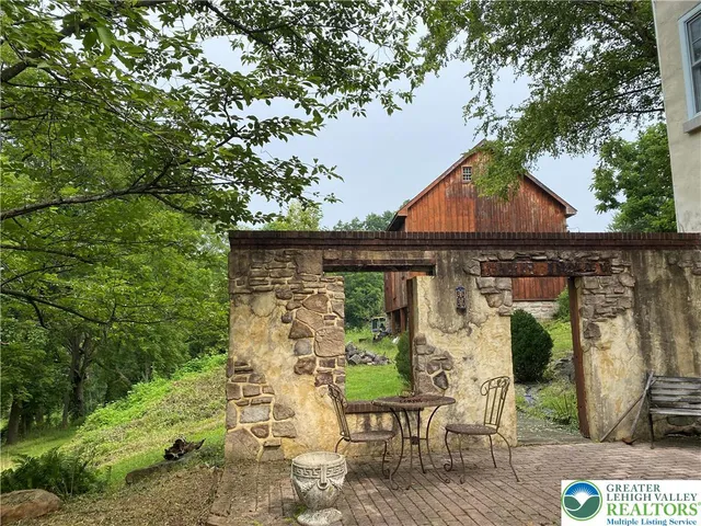 a front view of a house with a yard and porch