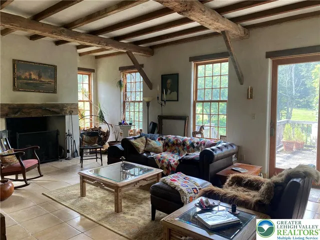 a room with furniture and a potted plant