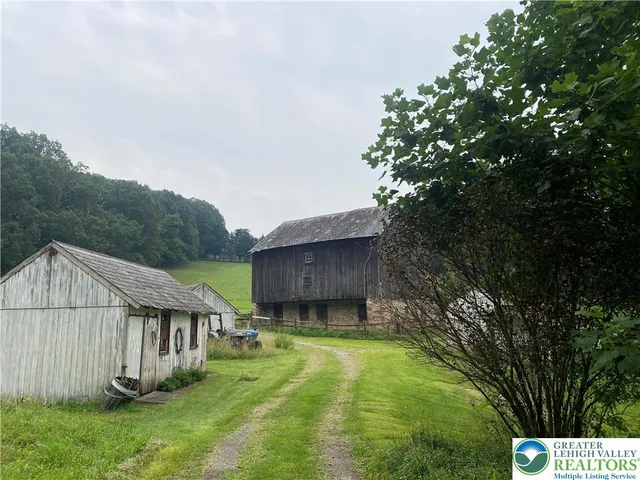 a kitchen with a table and chairs in it
