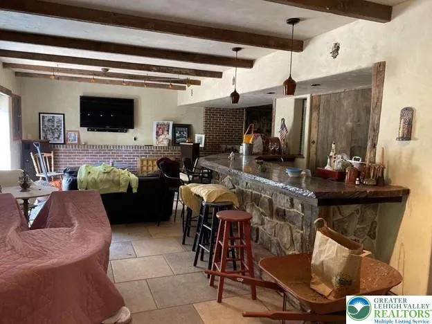 a view of a chairs and table in the garden