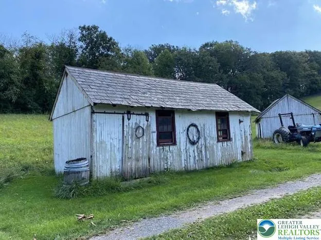 a bed room with a bed mirror and a window
