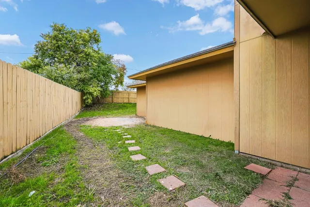 a backyard of a house with seating space