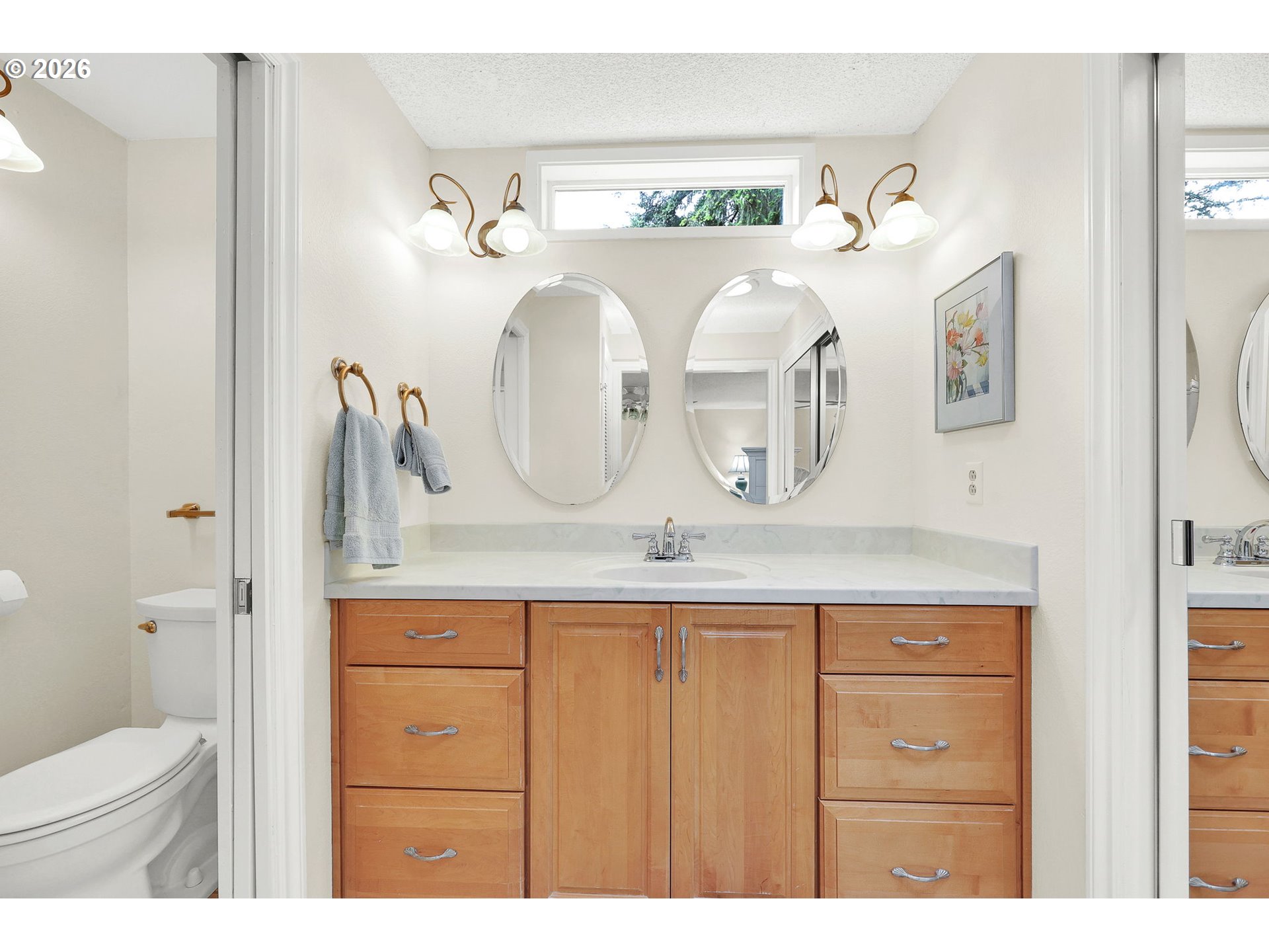 88108 Tiki Lane Springfield, OR 97478 - Photo 37 of 48 a bathroom with a granite countertop sink a toilet and a mirror