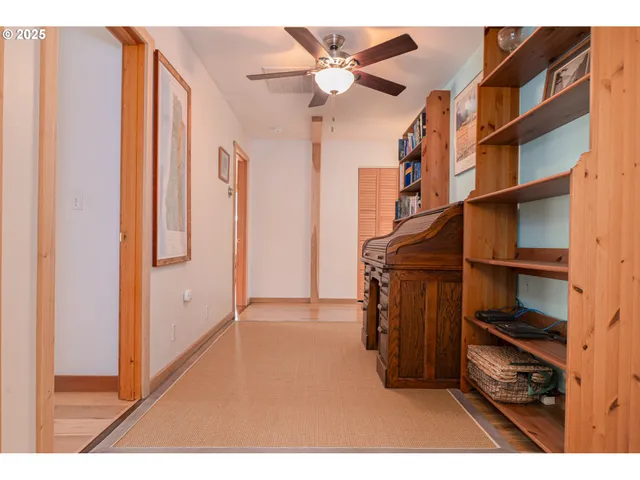 a view of living room with furniture and book shelf