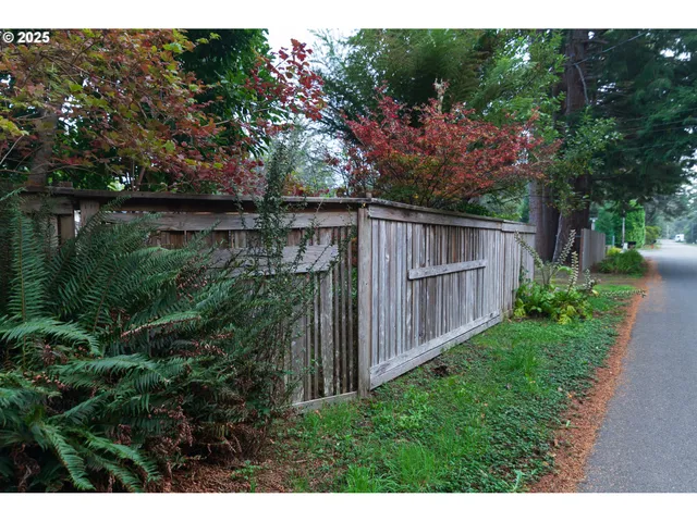 a view of a backyard with sitting area