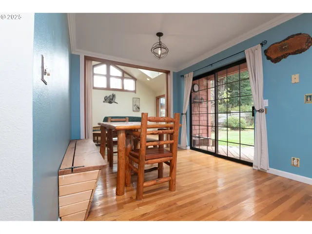 a dining room with furniture window wooden floor