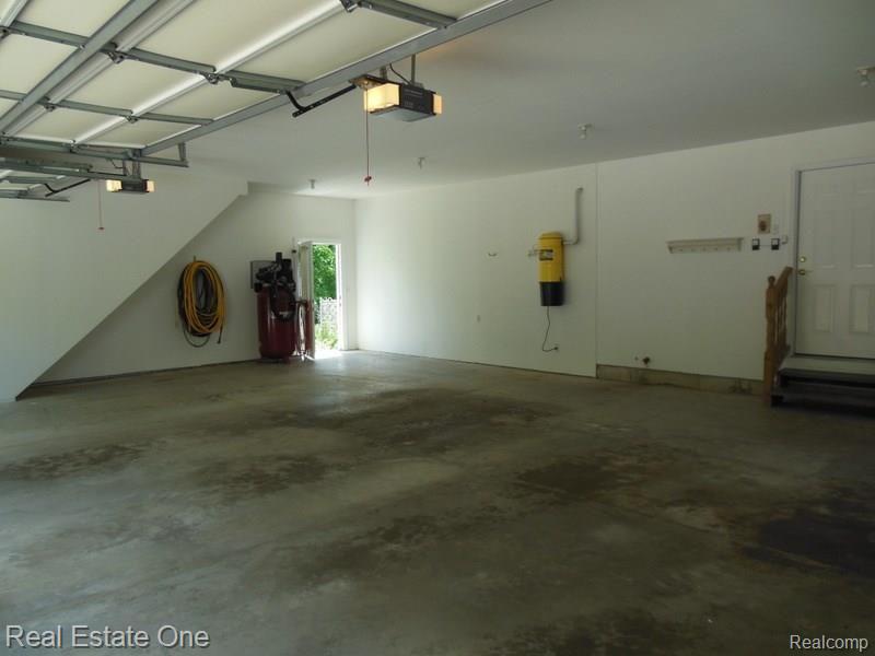 10155 Roberts Road Gregory, MI 48137 - Photo 68 of 89 3+ car attached garage. Extensive lighting package, garage door openers and key less entry.
