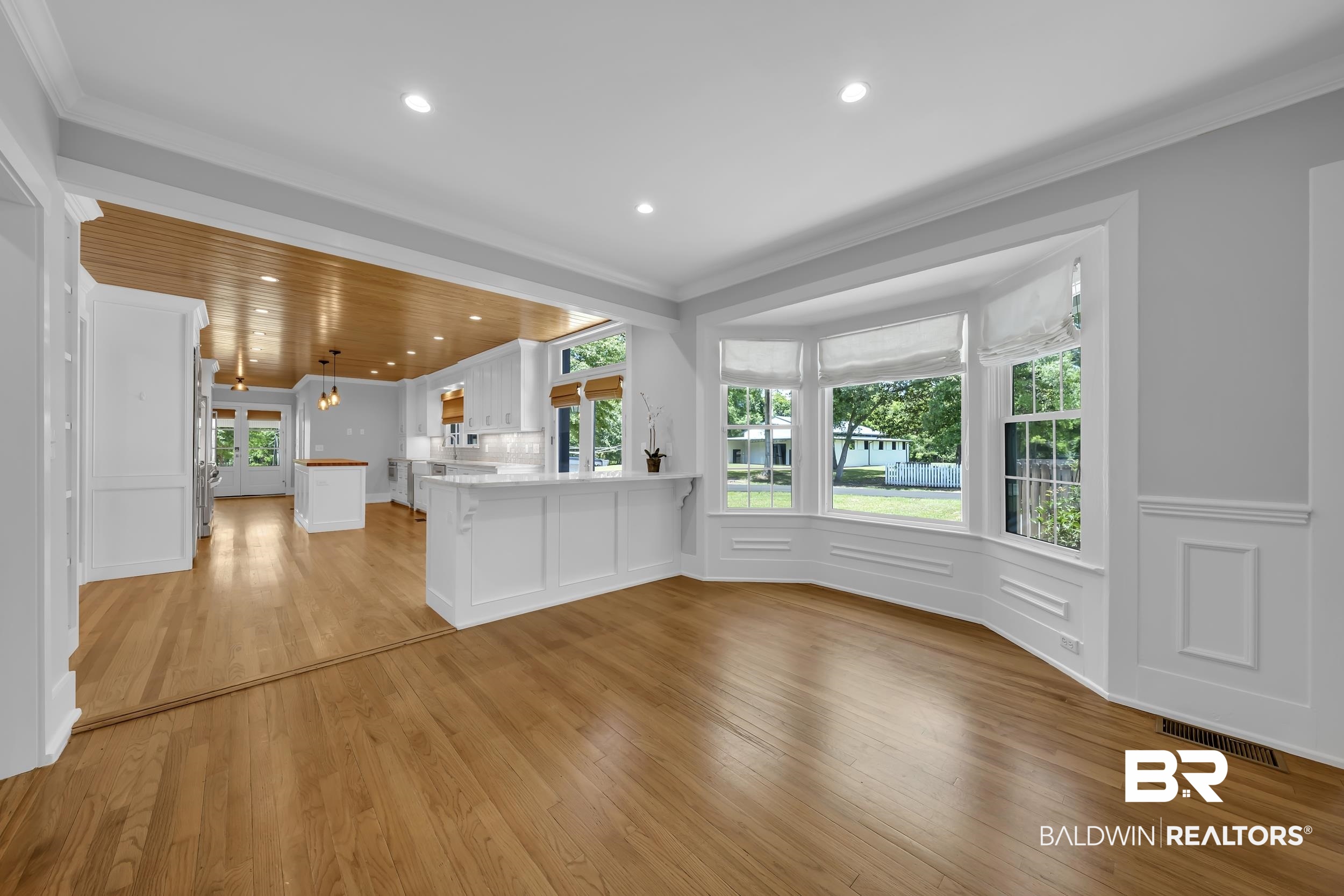 43199 Pine Grove Road Bay Minette, AL 36507 - Photo 34 of 71 Spacious interior featuring wood-finish flooring, a bright bay window with white trim, and crown molding