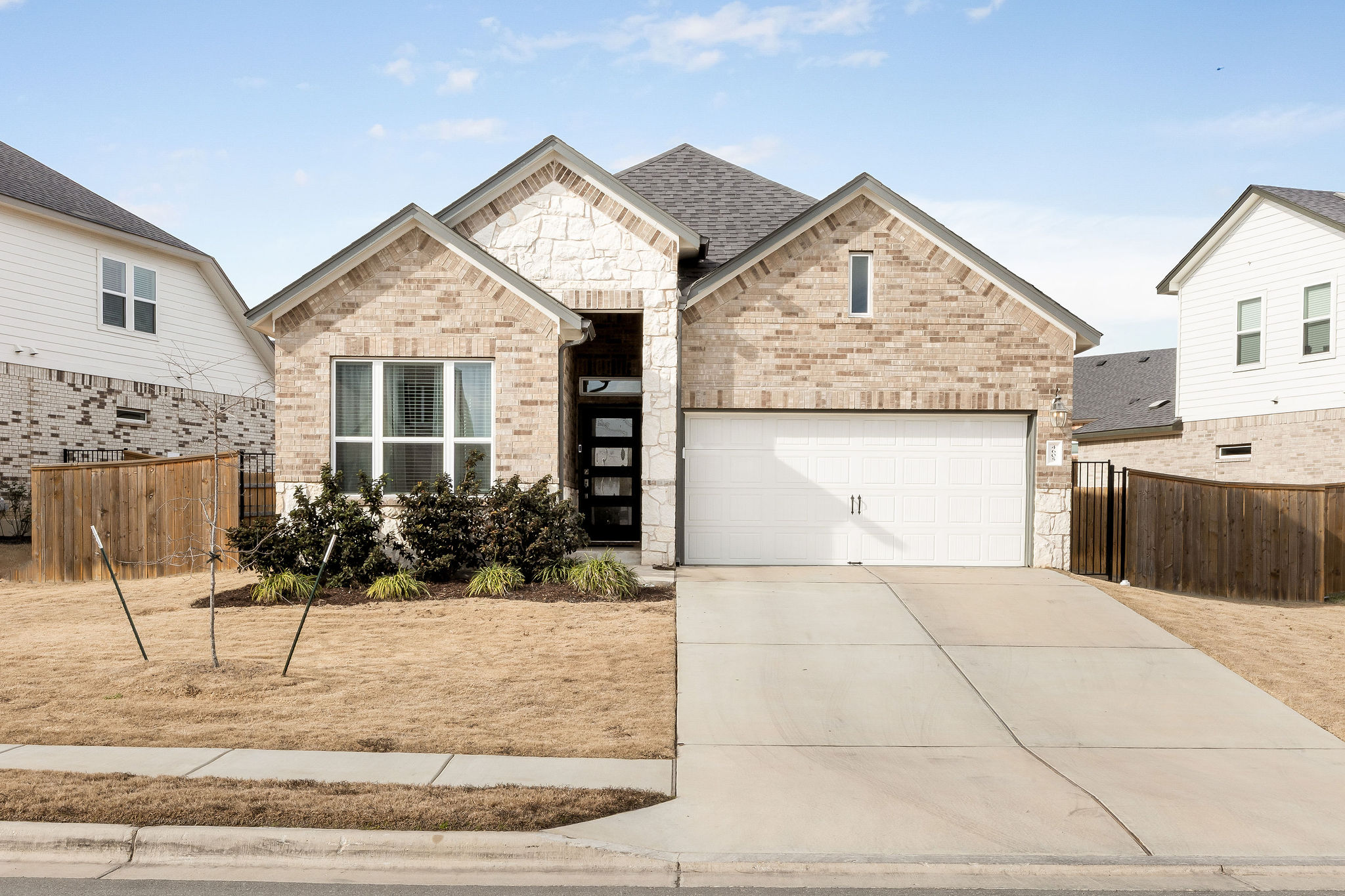 a view of a house with potted plants