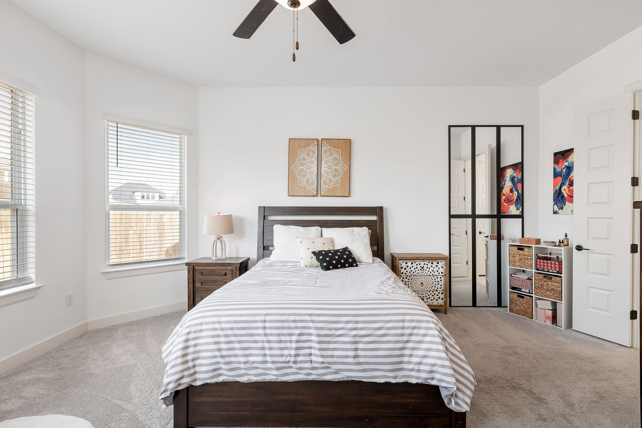 4605 Sea Salt Drive Austin, TX 78747 - Photo 21 of 40 a bedroom with a bed and a book shelf