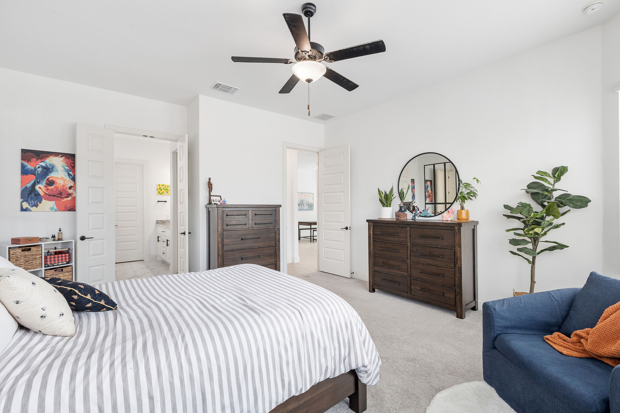 4605 Sea Salt Drive Austin, TX 78747 - Photo 22 of 40 a bedroom with a bed dresser and a sink