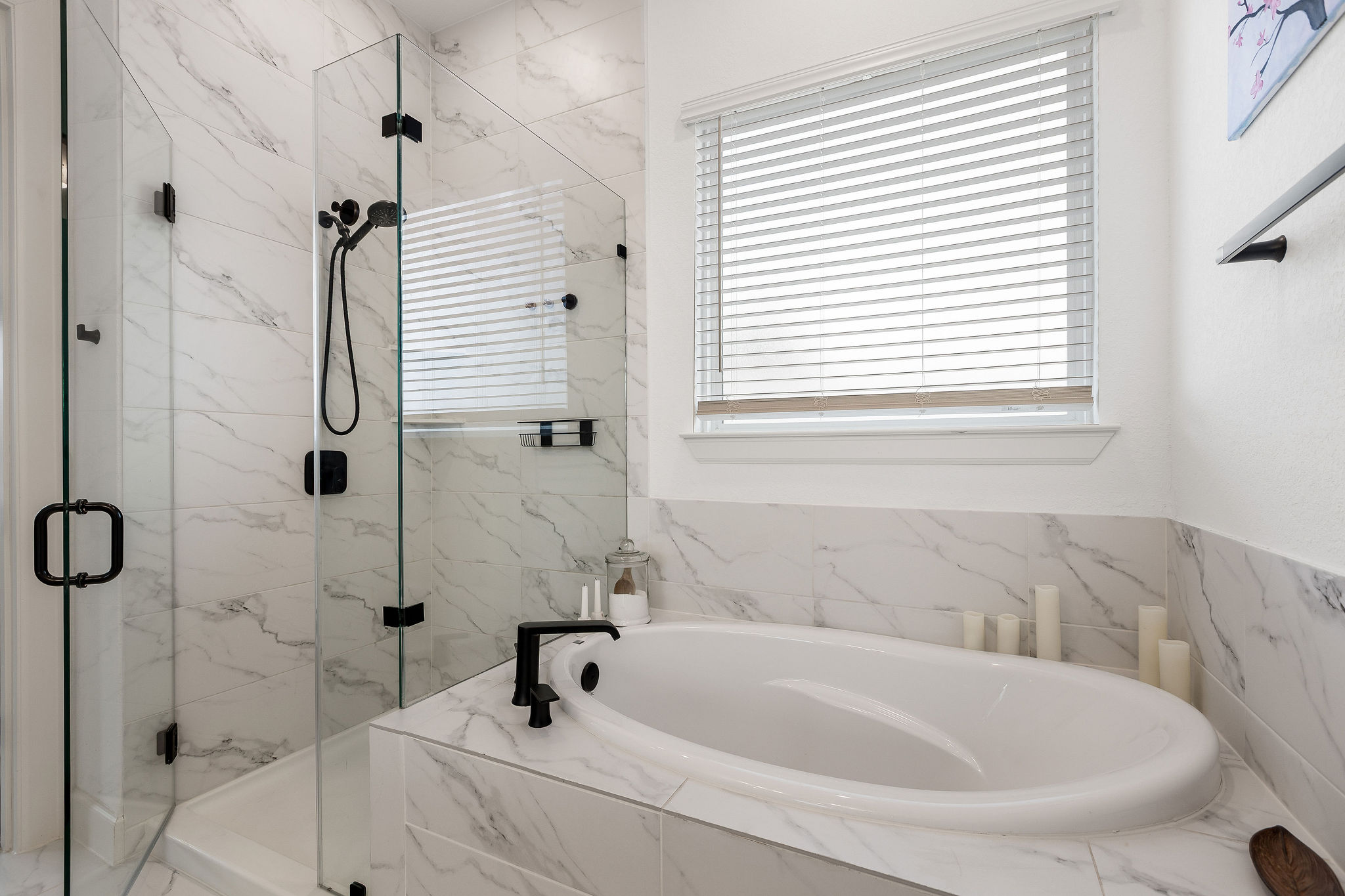 4605 Sea Salt Drive Austin, TX 78747 - Photo 27 of 40 a white bath tub sitting next to a white sink and a shower