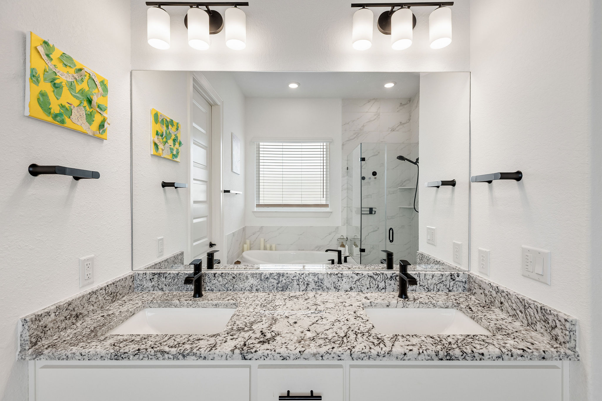 4605 Sea Salt Drive Austin, TX 78747 - Photo 28 of 40 a bathroom with a granite countertop sink and a mirror