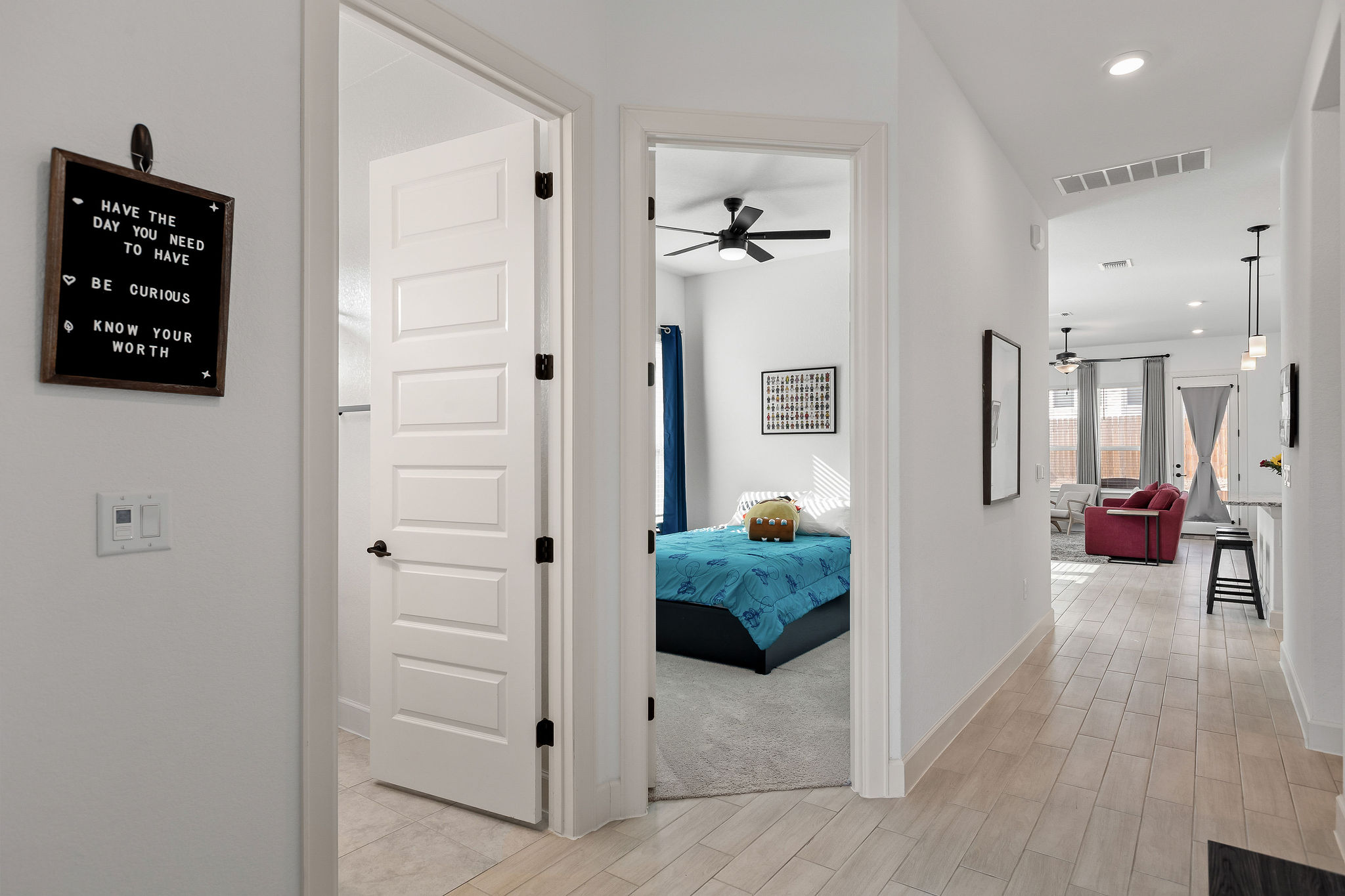 4605 Sea Salt Drive Austin, TX 78747 - Photo 30 of 40 a view of a hallway with couch and wooden floor