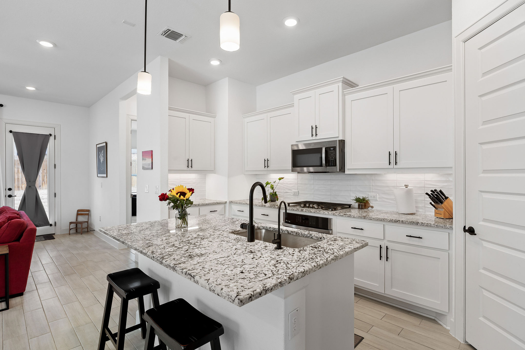 4605 Sea Salt Drive Austin, TX 78747 - Photo 10 of 40 a kitchen with granite countertop a sink appliances and cabinets