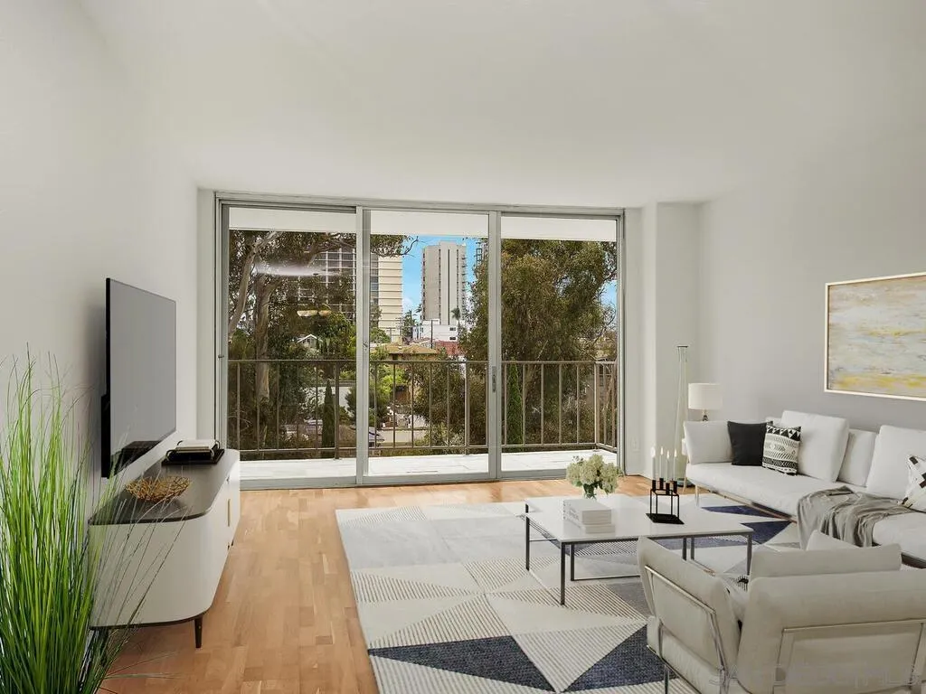 3634 7th Avenue, Unit 4B San Diego, CA 92103 - Photo 13 of 50 a living room with furniture and a flat screen tv