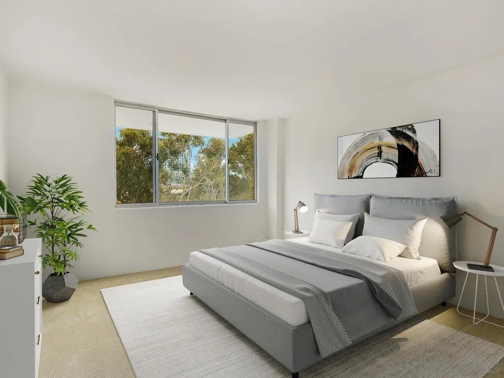 3634 7th Avenue, Unit 4B San Diego, CA 92103 - Photo 26 of 50 a bedroom with a bed and a potted plant