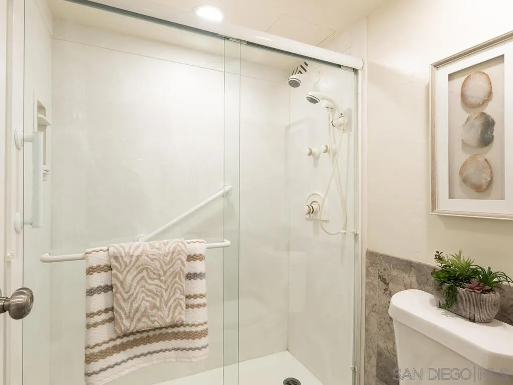 3634 7th Avenue, Unit 4B San Diego, CA 92103 - Photo 28 of 50 a bathroom with a shower curtain and a shower curtain