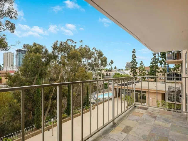 a view of a balcony with city view
