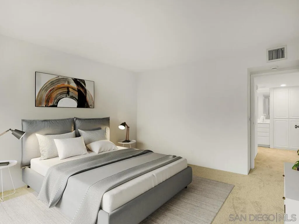 3634 7th Avenue, Unit 4B San Diego, CA 92103 - Photo 31 of 50 a bedroom with a bed and painting on the wall