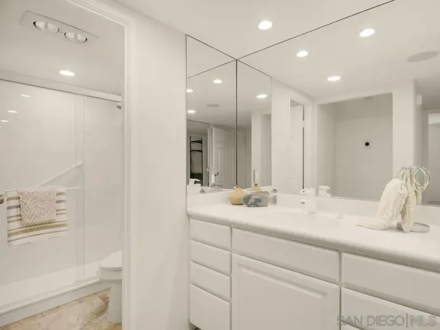 a bathroom with a shower and a sink